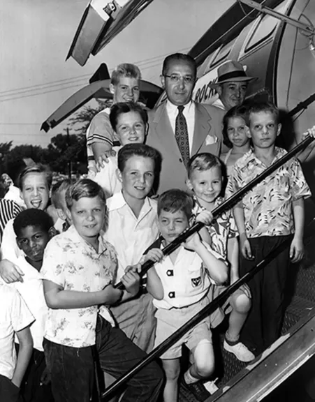 Fred brings a group of children to a Cardinals game in 1949