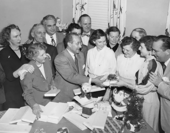 Fred Saigh distributes Christmas gifts