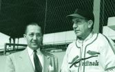 Fred and manager Eddie Dyer watch Cardinals go through first day drills at St. Petersburg.